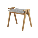 Fotpall i ek med grå fårskinnssits och snedställda ben i skandinavisk design