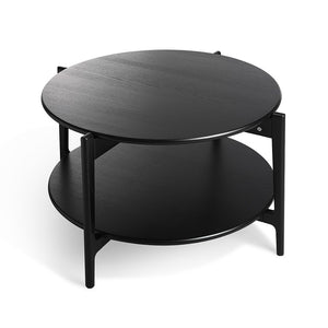 Runt soffbord i svart med två hyllplan och metallben, modernt skandinavisk design