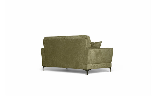 Grön sammetssoffa med metallben, vinkelfoto bakifrån som visar modern design och mjuk klädsel