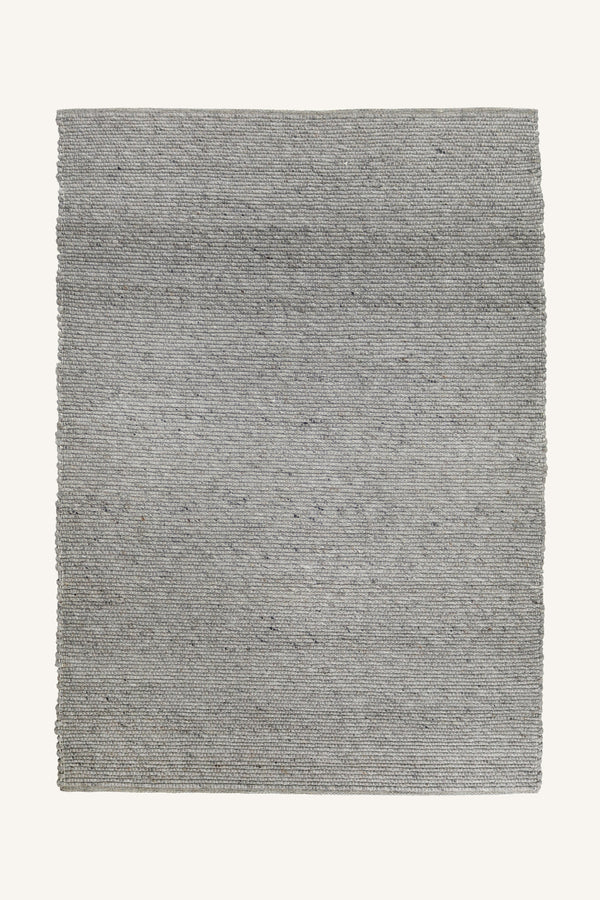 Ljusgrå handvävd jutematta med naturlig textur och fransar