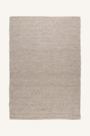 Beige handvävd matta i jute med naturlig textur och hållbar design