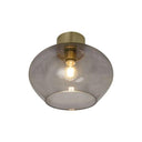 Taklampa med rökfärgad glaskupa och mässingsfäste, synlig glödlampa i modern design