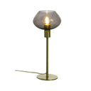 Bordslampa med rund rökfärgad glaskupa och mässingsstativ med glödlampa tänd