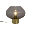 Bordslampa med rökfärgad glasskärm och mässingsfot med synlig glödlampa