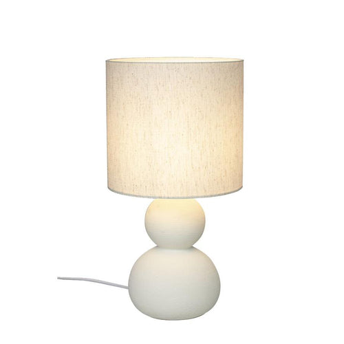 Bordslampa med beige linneskärm och vit keramikfot i två runda sfärer