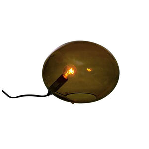 Oval bordslampа med bärnstensbrunt glas och synlig glödlampa, modern design med svart sladd