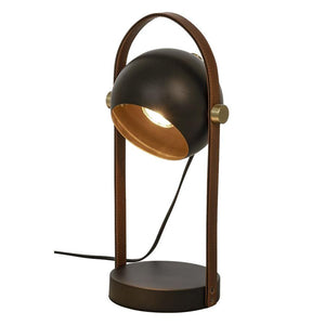 Bordslampa i mörk metall med gulddetaljer och brunt läderhandtag, justerbar spotbelysning