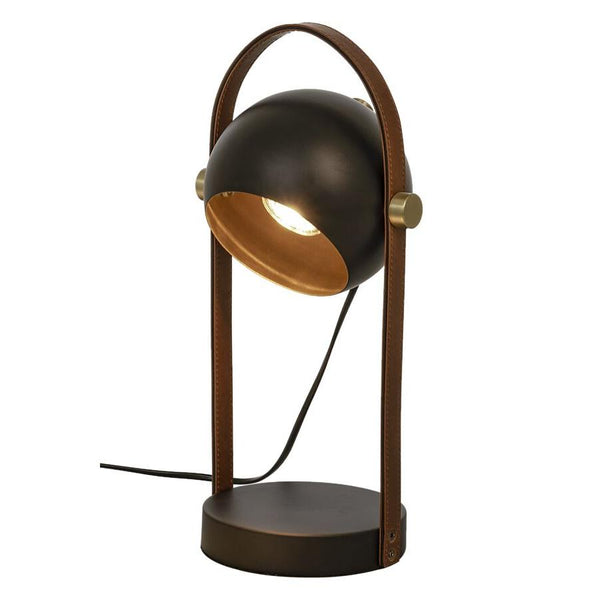 Bordslampa i mörk metall med gulddetaljer och brunt läderhandtag, justerbar spotbelysning