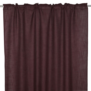 Mörkbrun gardin i linnetyg med rynkad överdel upphängd på gardinstång mot vit bakgrund