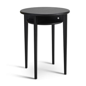 Runt svart sidobord med låda och tre ben i trä