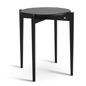 Runt sidobord i svart trä med tre ben och läderdetaljer