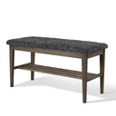 Bänk med grå fårskinnsdyna och träställning i mörkbrun ek med hylla