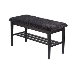 Svart hallbänk med fluffig sittdyna och förvaringshylla i trä