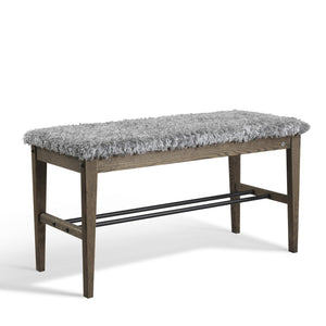 Hallbänk med grå fårskinnssits och mörkbrun träram med metallhylla för skor