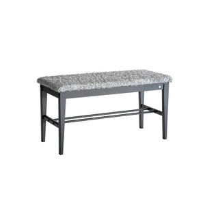 Hallbänk med grå långhårig sits och svarta träben med skohylla