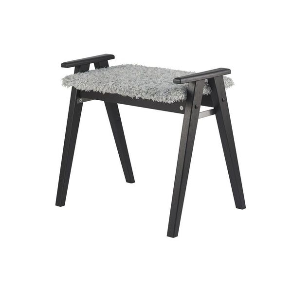 Grå pall med luddig sits och svarta träben, perfekt som fotpall eller extra sittplats