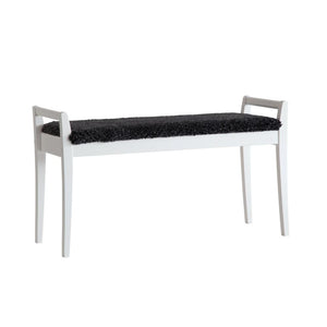 Vit hallbänk med svart fårskinnsdyna, slät design med fyra ben och armstöd
