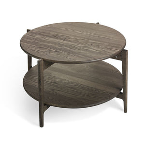 Runt soffbord i mörkgrå ek med två plan och träben i skandinavisk design