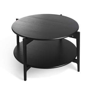 Runt soffbord i svart med två våningar och metallben, modernt scandinavisk design