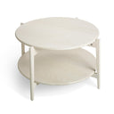 Runt soffbord i ljust trä med två hyllplan och vitlackerade ben i skandinavisk design