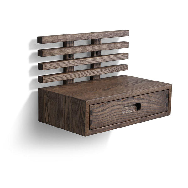 Väggmonterad sängbord i mörkbrun trä med låda och hyllor i modern skandinavisk design