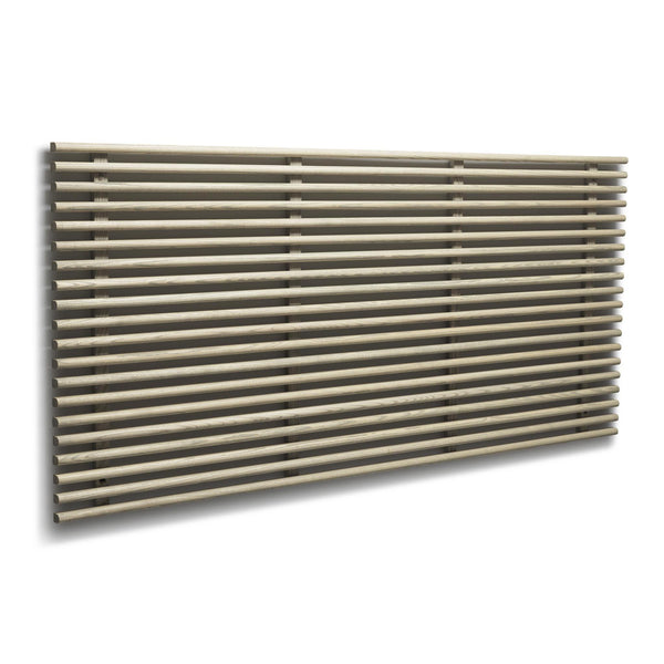 Horisontell designradiator i brons med tunna runda rör och moderna fästen mot vit vägg