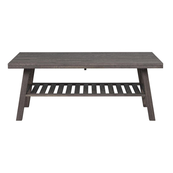 Grått soffbord i trä med avlastningshylla och snedställda ben i modern skandinavisk design