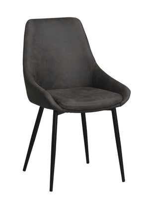 Grå matstol i sammet med svarta metallben och ergonomisk rygg