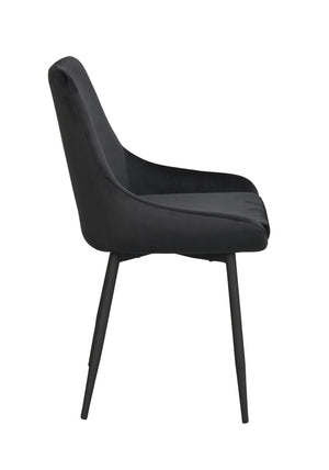 Svart matstol i sammet med svarta metallben, visad från sidan