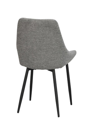 Grå stoppad matstol med svarta ben, sedd bakifrån i modern skandinavisk design