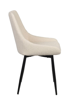 Beige stol med hög rygg och svarta ben i sidovy mot vit bakgrund