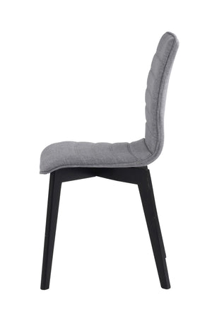 Grå stoppad matstol med svarta träben, sidovy som visar ergonomisk rygg och sits