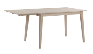 Ljust trä matbord med utdragsskiva och snedställda ben i skandinavisk design