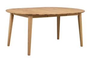 Runt matbord i ljus ek med fyra ben i modern skandinavisk design