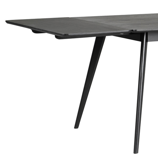 Utdragbart matbord i grå ek med svarta snedställda ben i modern skandinavisk design