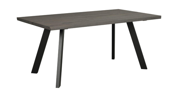 Matbord med grå träskiva och sneda svarta metallben i modern skandinavisk design