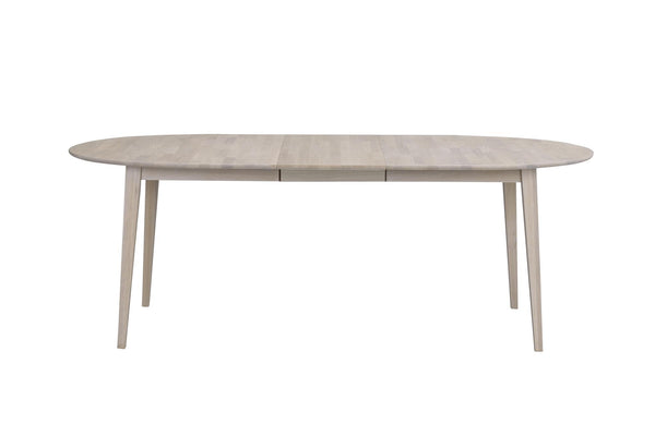 Oval matbord i ljust trä med utdragsfunktion och fyra ben i skandinavisk design