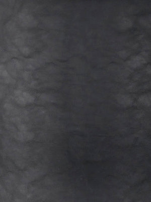 Mörk gråmelerad texturerad yta med skifferliknande utseende, industriell väggbeklädnad eller kakelplattor