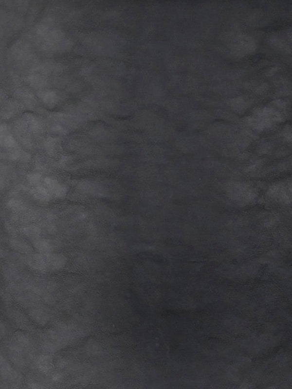 Mörk gråmelerad texturerad yta med skifferliknande utseende, industriell väggbeklädnad eller kakelplattor