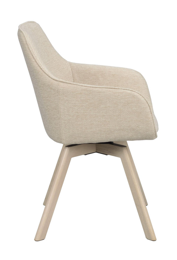 Beige stoppad matstol med träben i ljust trä, sidovy som visar svängbar funktion och ergonomisk design