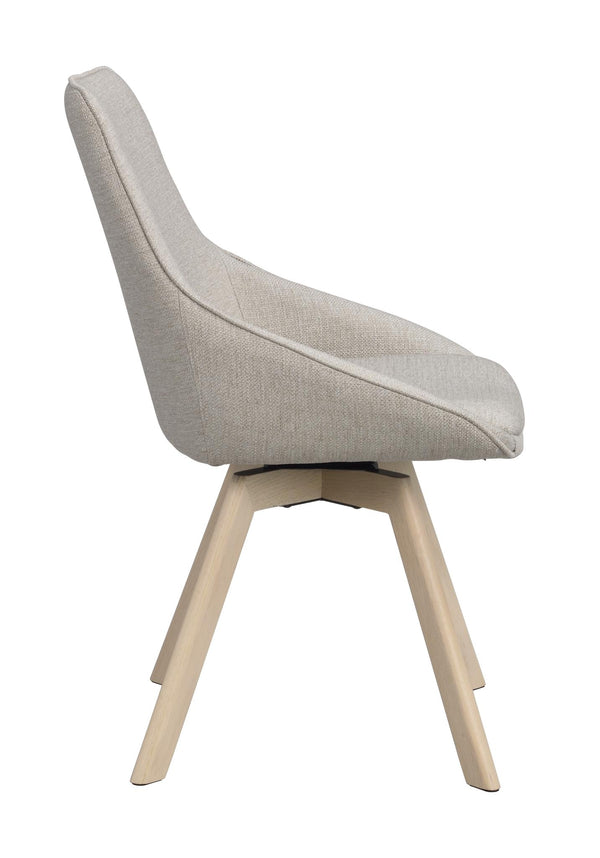 Beige matstol med hög rygg och ljusa träben, sidovy som visar svängbar funktion och modern design