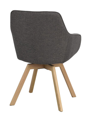 Grå stoppad stol med träben i ek, snett bakifrån, modern skandinavisk design med svängda armstöd