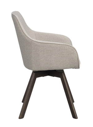 Grå stoppad matstol med träben i mörkt trä, sidovy som visar ergonomisk design och svängbar funktion