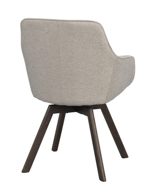 Beige stoppad stol med mörka träben, sedd bakifrån