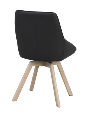 Svart matstol med ljusa träben, sedd bakifrån, modern skandinavisk design med sits i konstläder