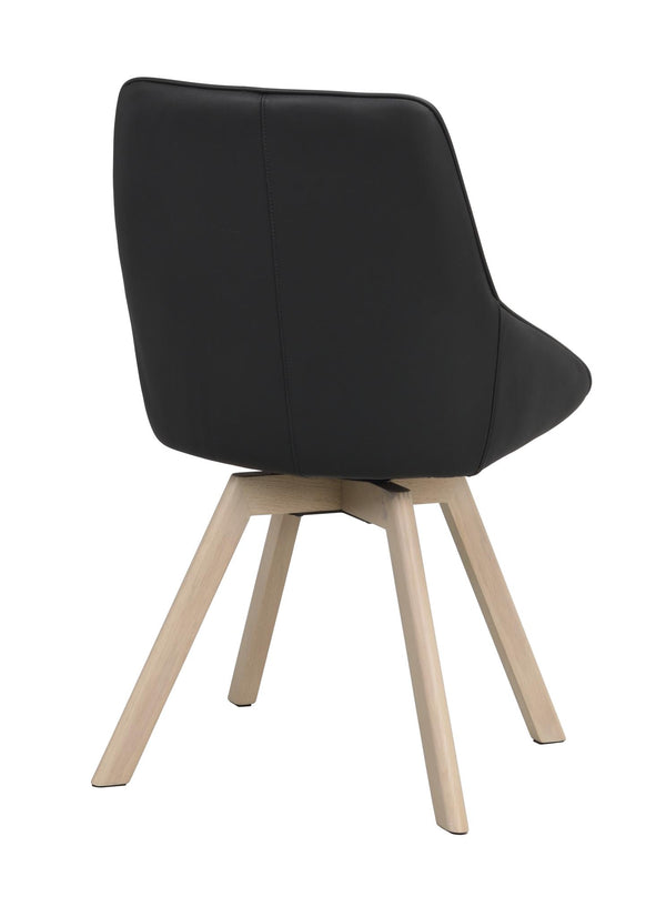 Svart matstol med ljusa träben, sedd bakifrån, modern skandinavisk design med sits i konstläder