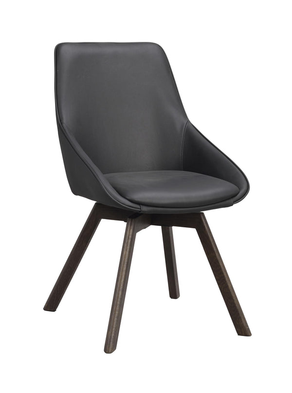 Grå matstol i konstläder med mörkbruna träben och svängbar funktion