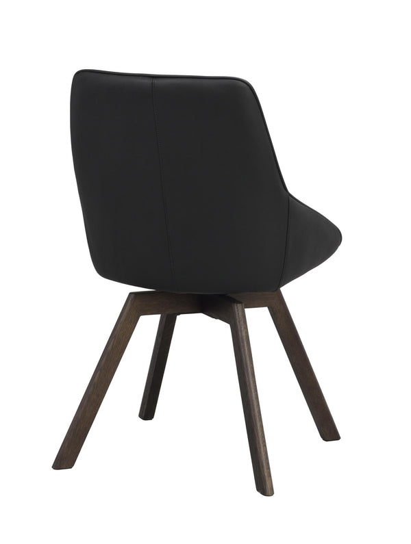 Svart matstol med stoppad sits och rygg i konstläder på mörkbruna träben, sedd bakifrån