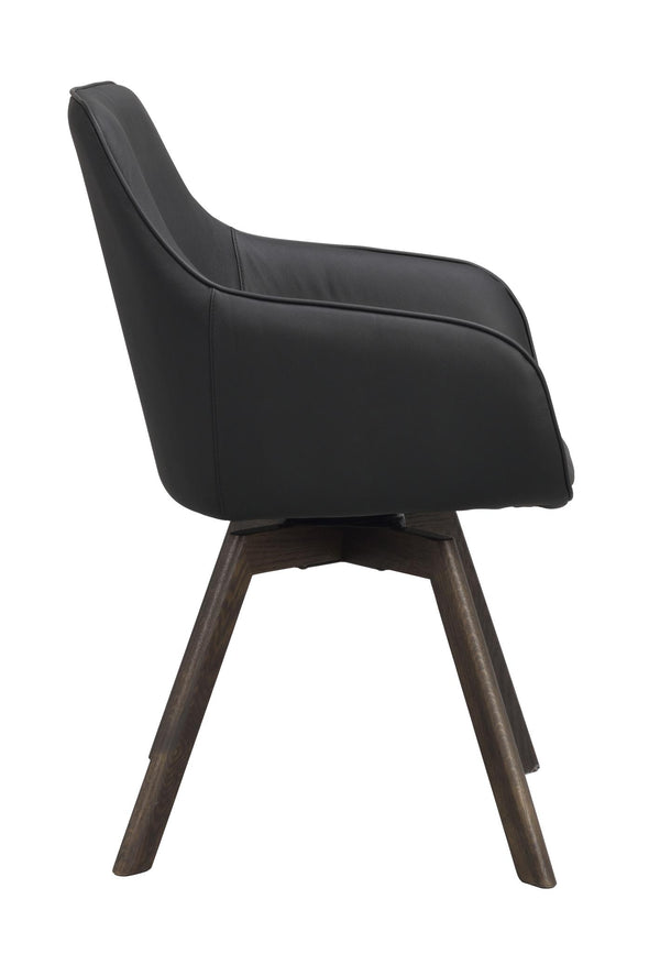 Svart matstol i konstläder med träben i mörk ek, visad från sidan