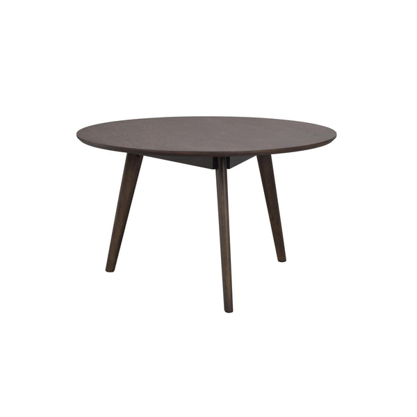 Runt matbord i mörkbrun ek med fyra ben i modern skandinavisk design